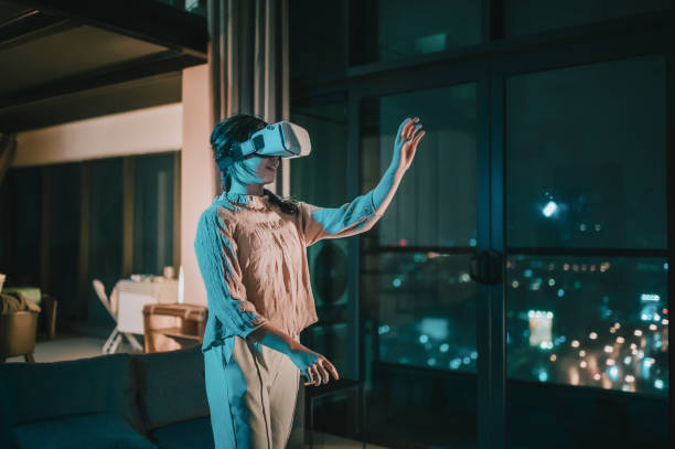 A woman uses a VR headset in a modern living room, highlighting the immersive experience of a VR setup.