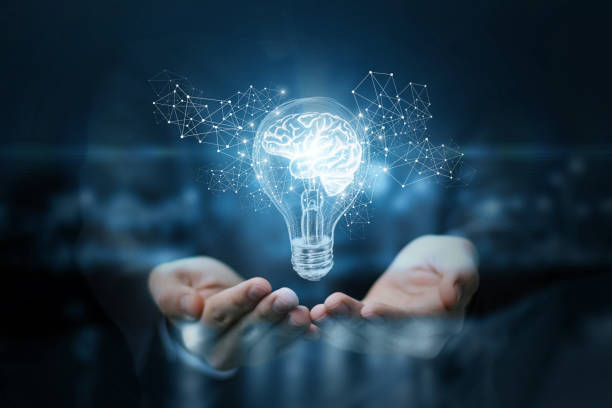 A pair of hands holding a glowing light bulb with a digital brain inside, symbolizing smart light technology.